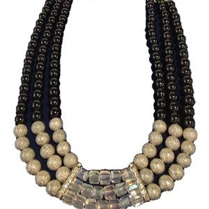 Elevate Your Style with this Triple-Strand Beaded Beauty